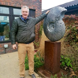 Hamish Mackie with Sculpture 'Ammonite'