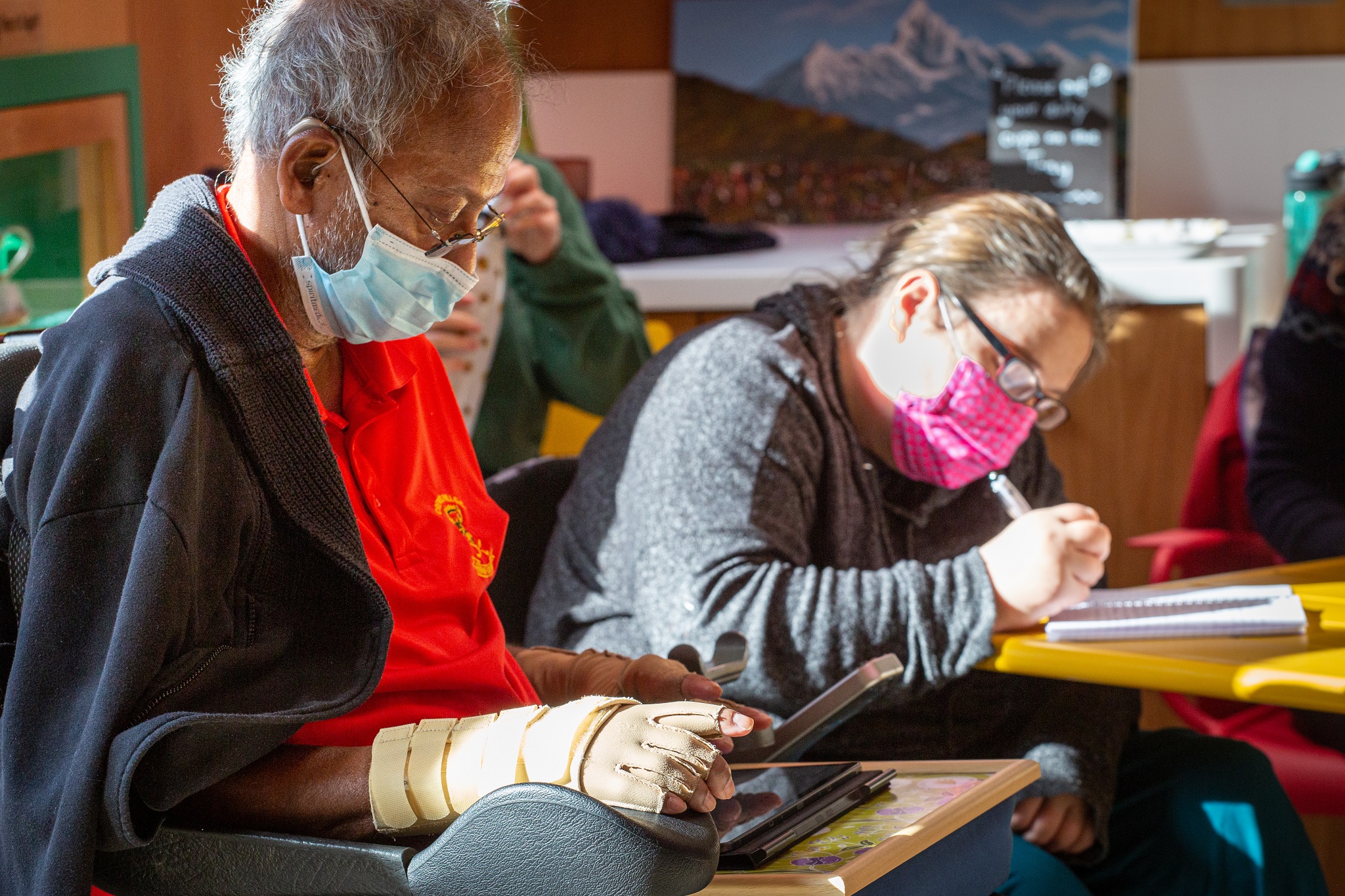 Patients writing in the workshop